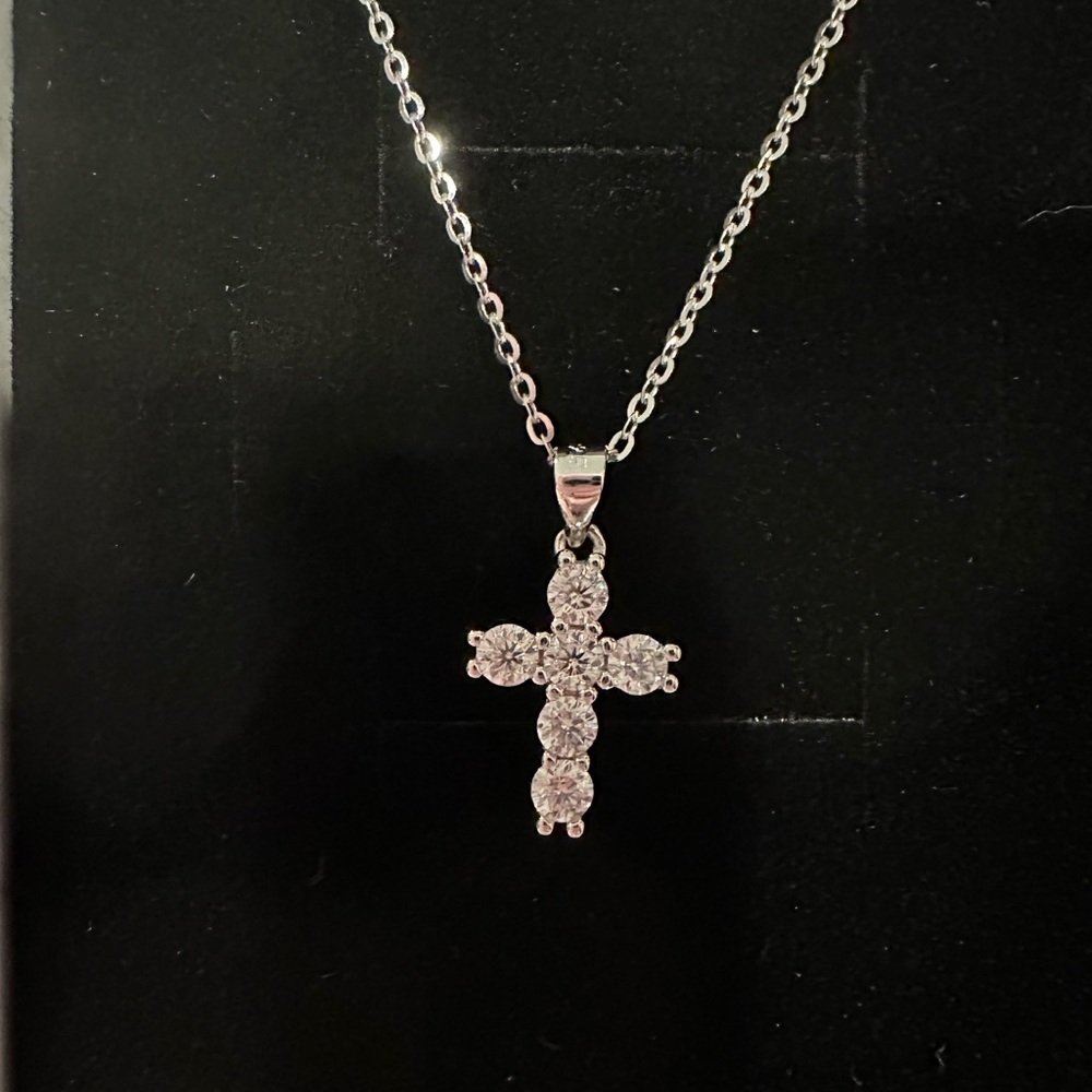 Brand new Moissanite cross necklace set in .925 Sterling Silver.